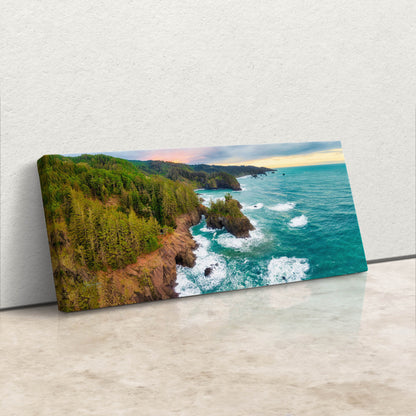 an aerial view of the ocean near a cliff