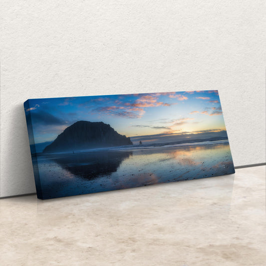 a picture of a beach with a mountain in the background