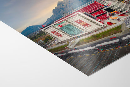 The image is a collage of various scenes, including a large stadium with a prominent logo, a parking lot, and mountains in the background.