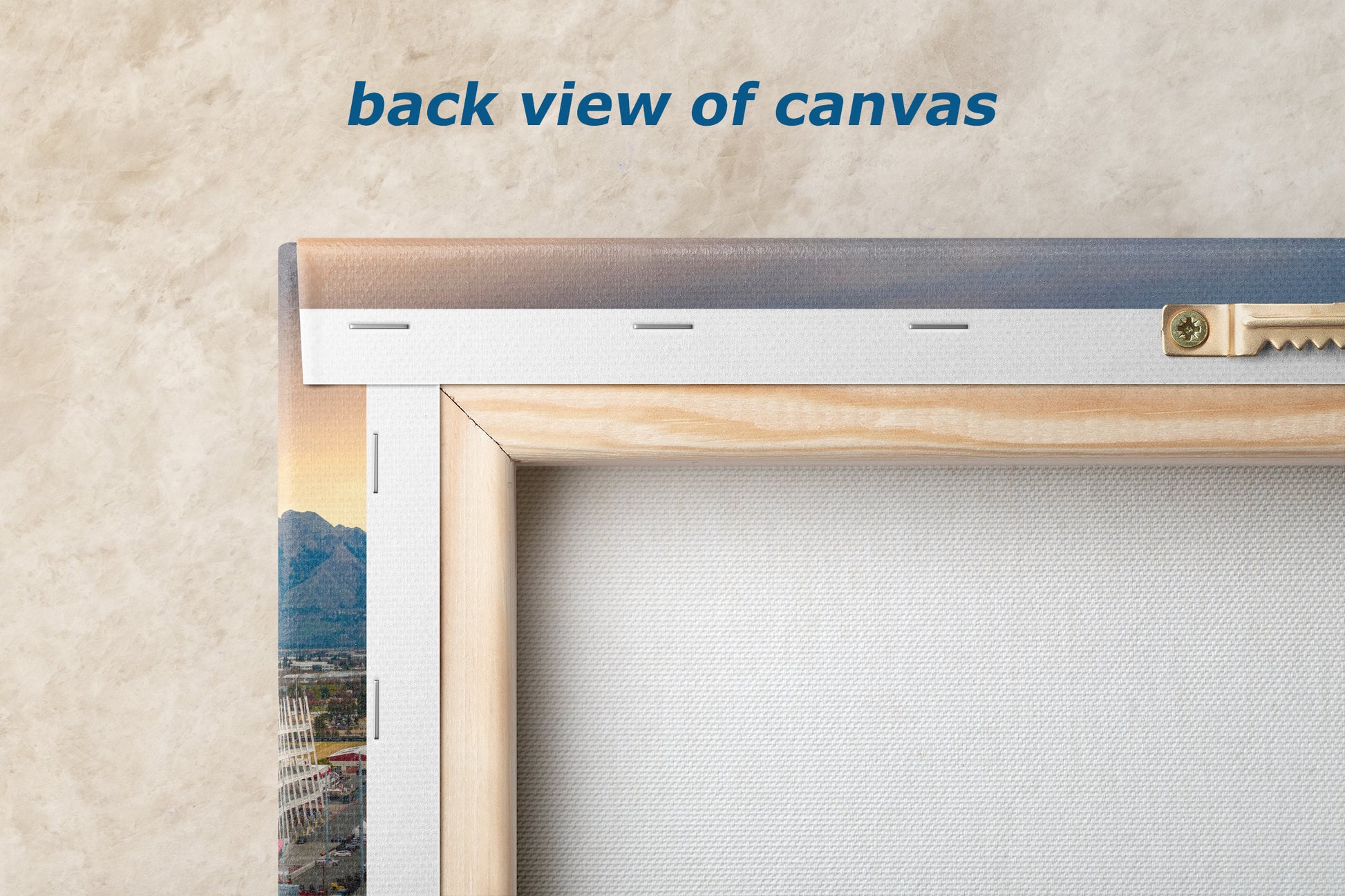 a back view of a canvas with a wooden frame, displaying a cityscape on the canvas.