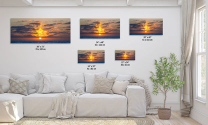 a living room with a white couch and four pictures on the wall