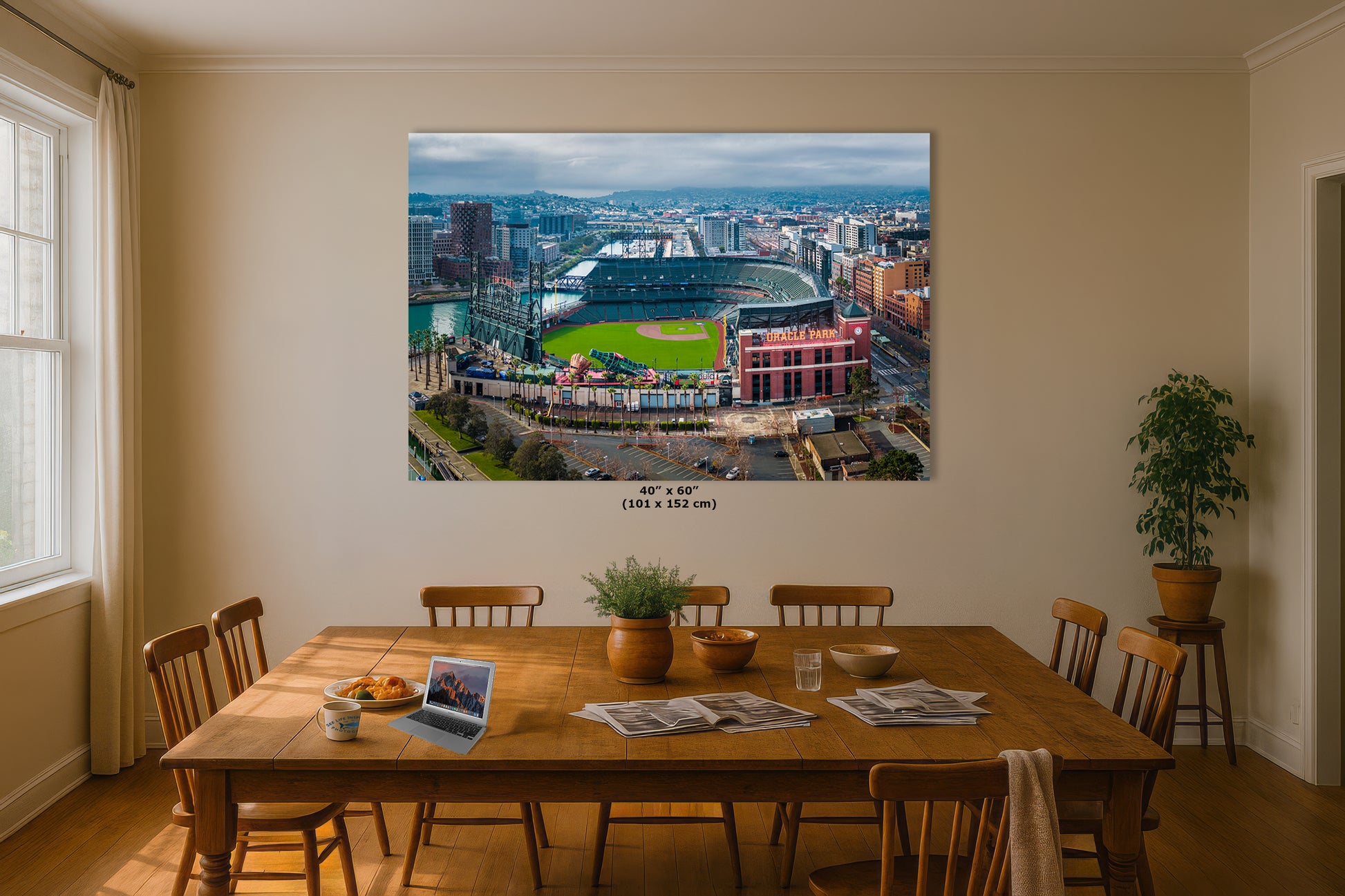 a large, colorful aerial view of a city, with a baseball stadium in the center. The cityscape is surrounded by buildings and roads, creating a vibrant urban landscape.