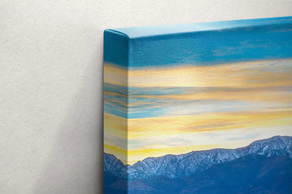 Side view of the canvas depicting the layered colors of sunset skies over Death Valley's Badwater Basin, with a moonrise.