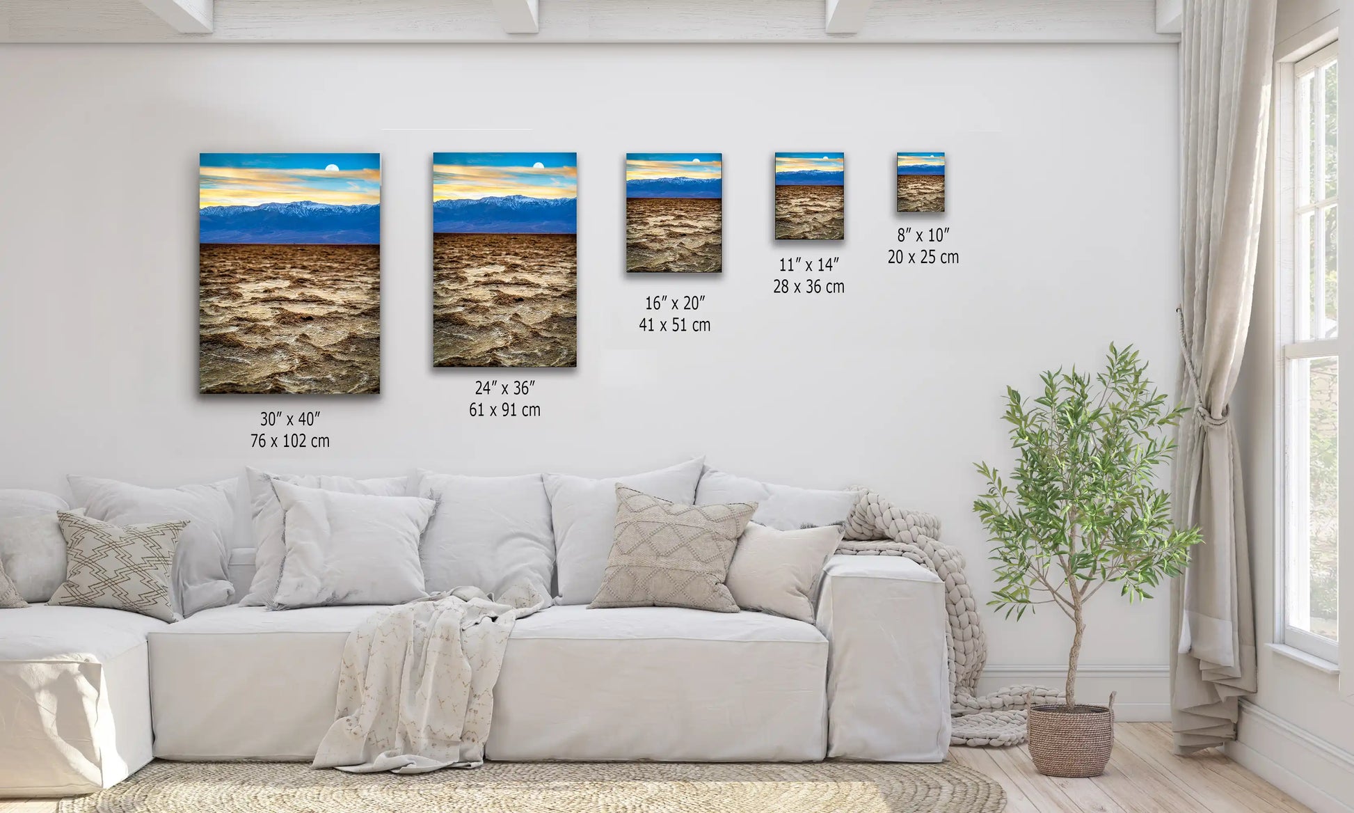 Wall art of varying sizes on display, each depicting the stunning landscape of Death Valley's Badwater Basin.