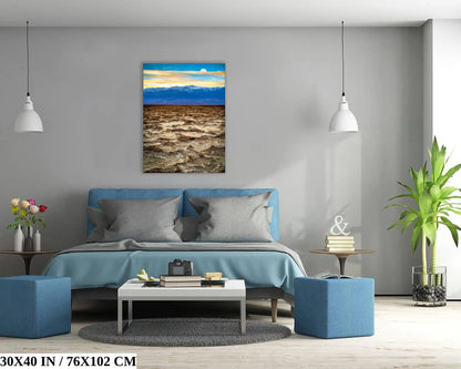 A 30x40 inch canvas of Death Valley's Badwater Basin above a bed, creating a focal point in a modern bedroom.