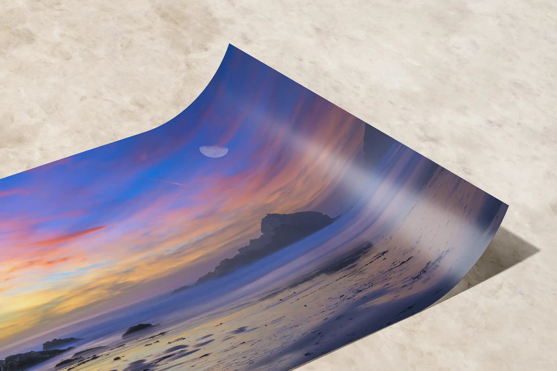 Detailed view of a premium paper print capturing the soothing hues of a Big Sur beach sunset, ready for framing.