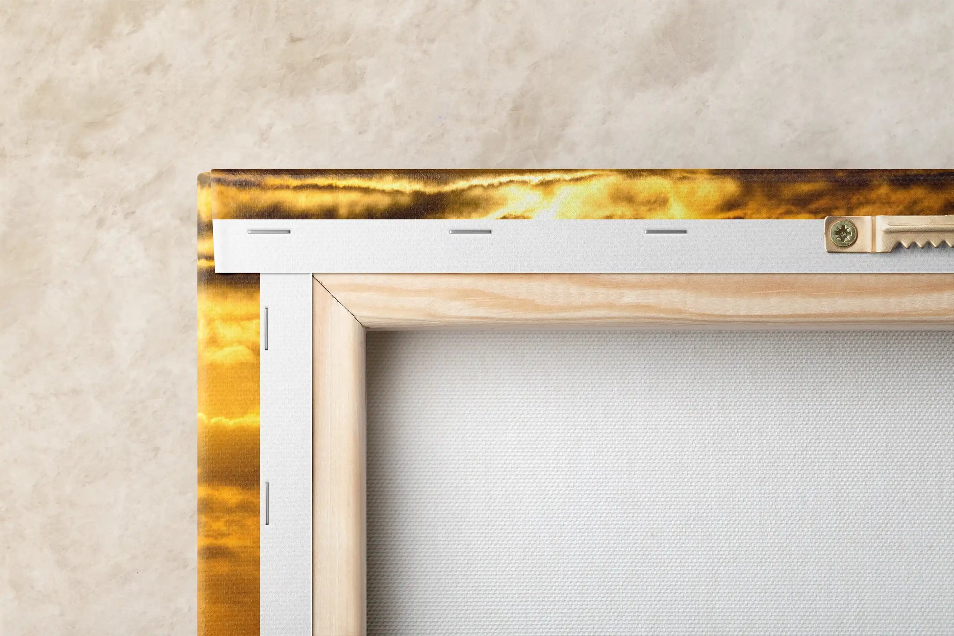 Close-up of the back of a canvas print, displaying the sturdy frame and mounting hardware of a California sunset art piece.