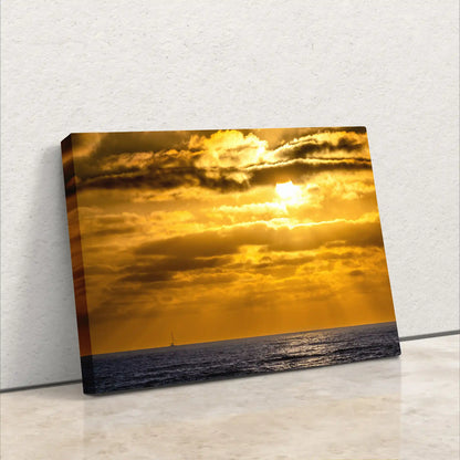 Side view of a canvas print depicting a California sunset, emphasizing the thickness and side image continuation.