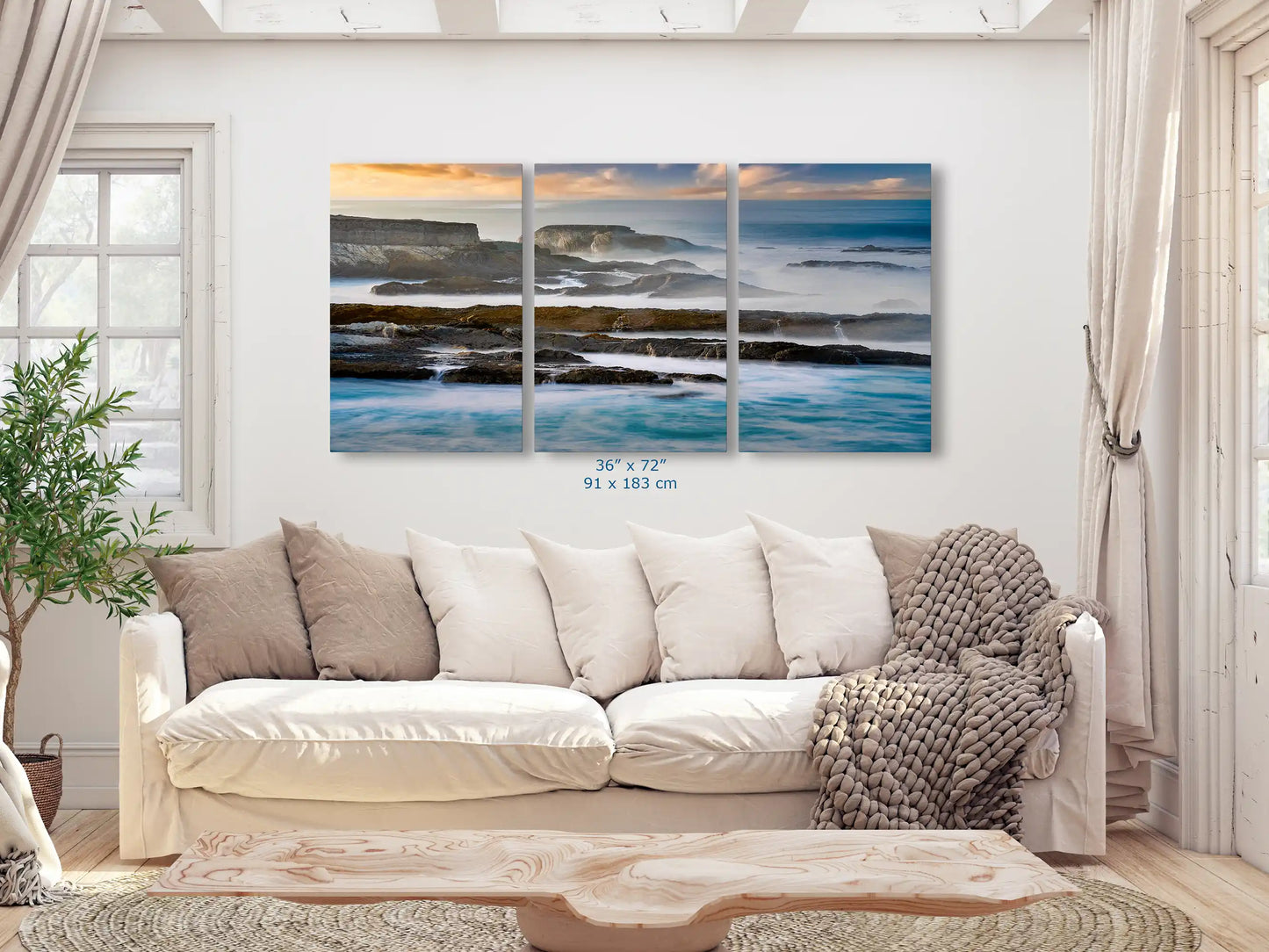 Three-panel wall art 36x72-inch set in a living room, each panel capturing a segment of the vast California Pacific Seascape, exuding tranquility and natural elegance.