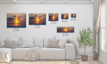 Living room decorated with multiple sizes of ocean sunset canvas prints, creating a harmonious wall art display.