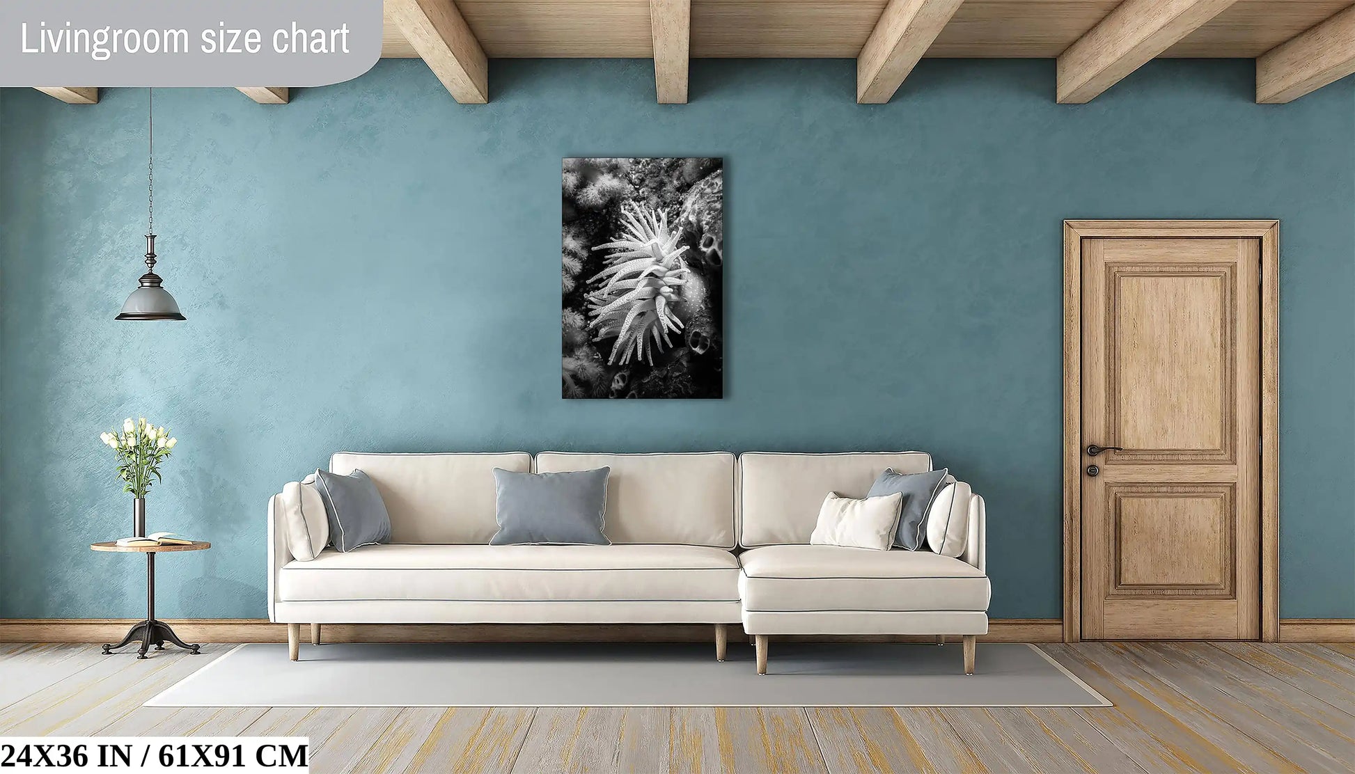 A large, 24x36-inch monochrome canvas of a Crimson Anemone creates a focal point above a living room sofa, blending well with contemporary interiors.