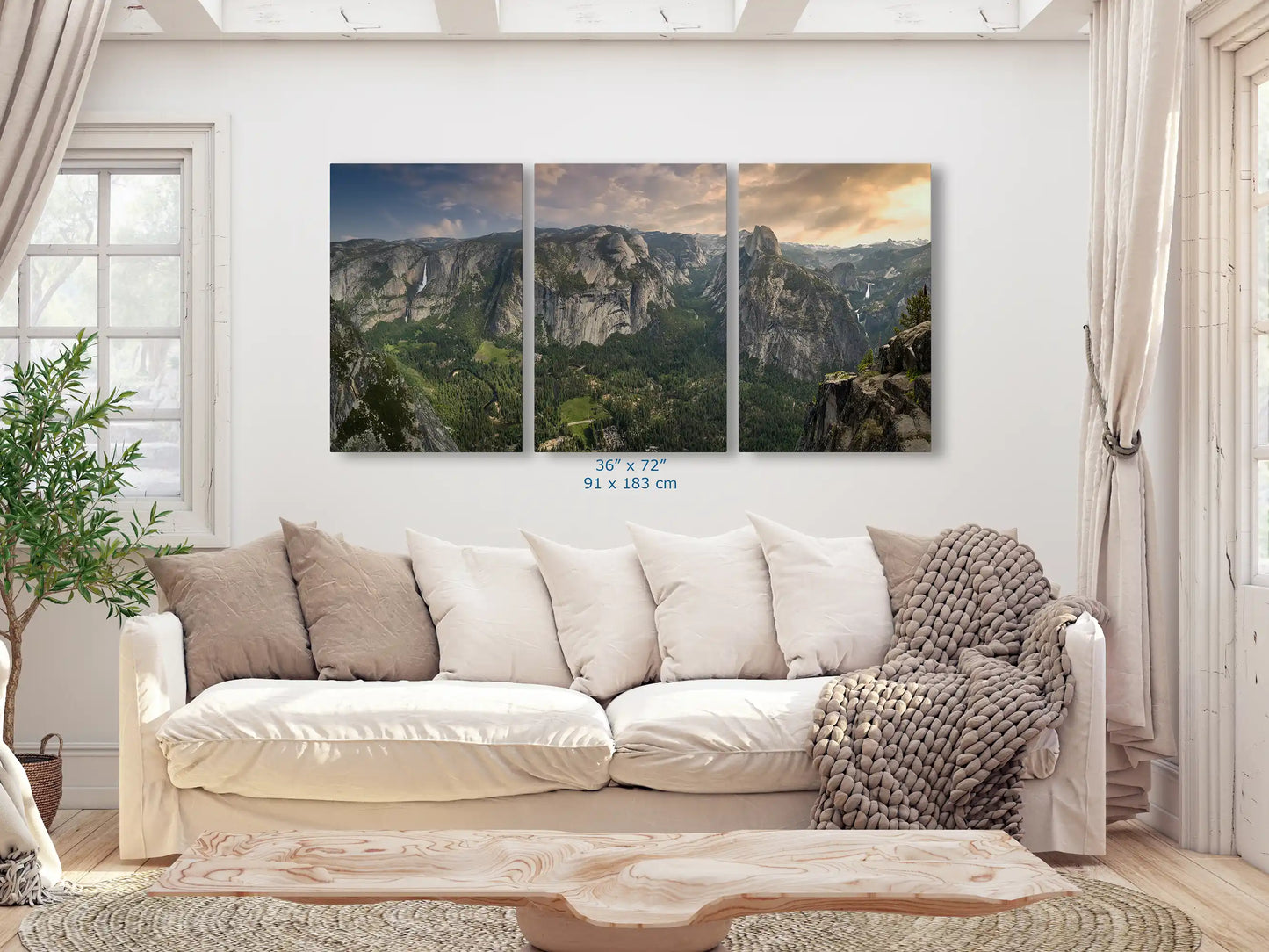 Wide triptych print of Yosemite Valley from Glacier Point, 36x72 inches, adorning a living room wall.