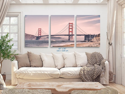An expansive 40x90 canvas print of the Golden Gate Bridge in vintage tones, making a grand statement in a cozy living room.