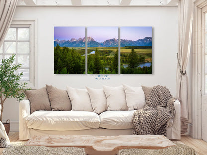 A large three-panel canvas print of Grand Teton Mountains, measuring 36x72 inches, in a cozy living room.