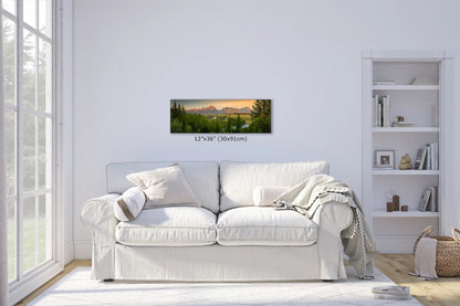 12x36-inch wall art above a sofa in a bright living room, panoramic view of the Teton Mountains and Snake River at sunrise.