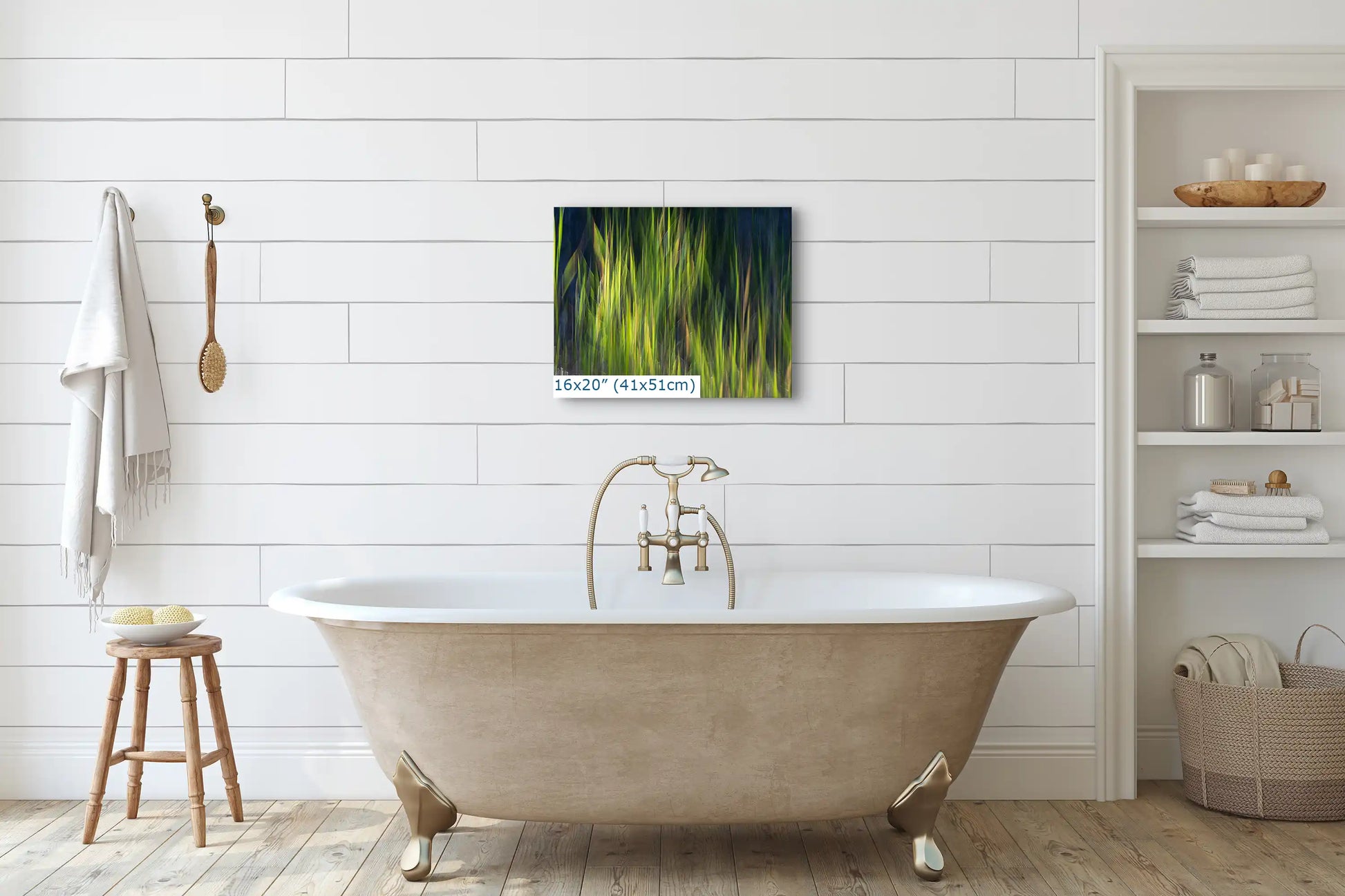A 16"x20" green and yellow abstract canvas art hanging above a vintage bathtub, contributing a pop of color and dynamic to the serene, white bathroom setting.