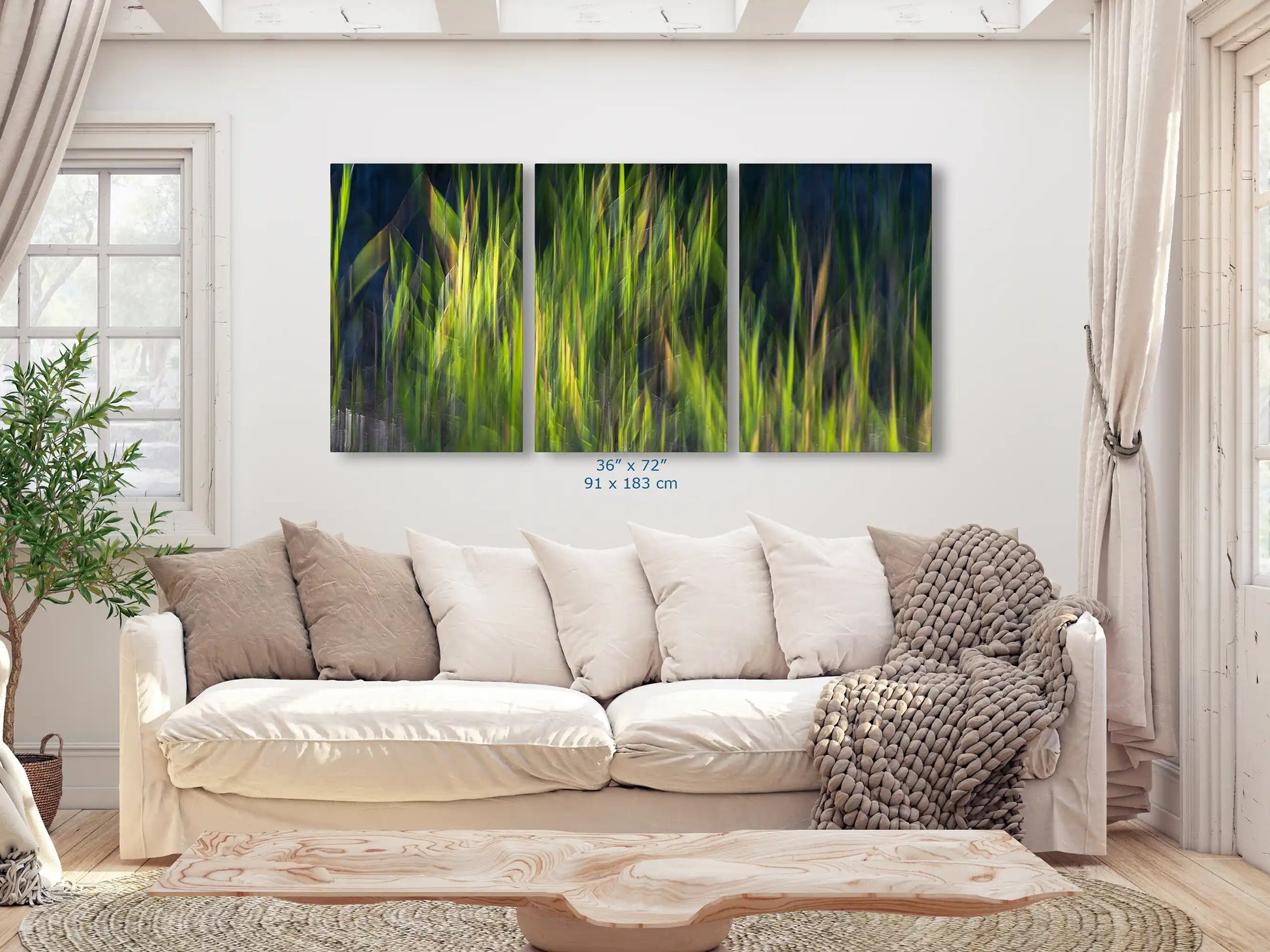 A grand 36"x72" canvas print, with a lively abstract green pattern, dominates the living space above a cozy sofa, integrating art with everyday living.