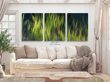 An expansive 40"x90" wall canvas, portraying abstract strokes in shades of green, spans across the living room wall, serving as a dramatic focal point above the sofa.