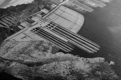 Close-up showing the detailed texture of a canvas print featuring the Hoover Dam in black and white, emphasizing the contrast and depth.