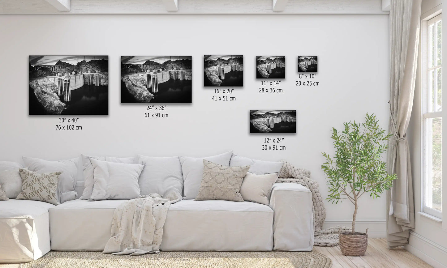 Hoover Dam in black and white, showcased in various canvas sizes on a living room wall, illustrating scale and perspective.