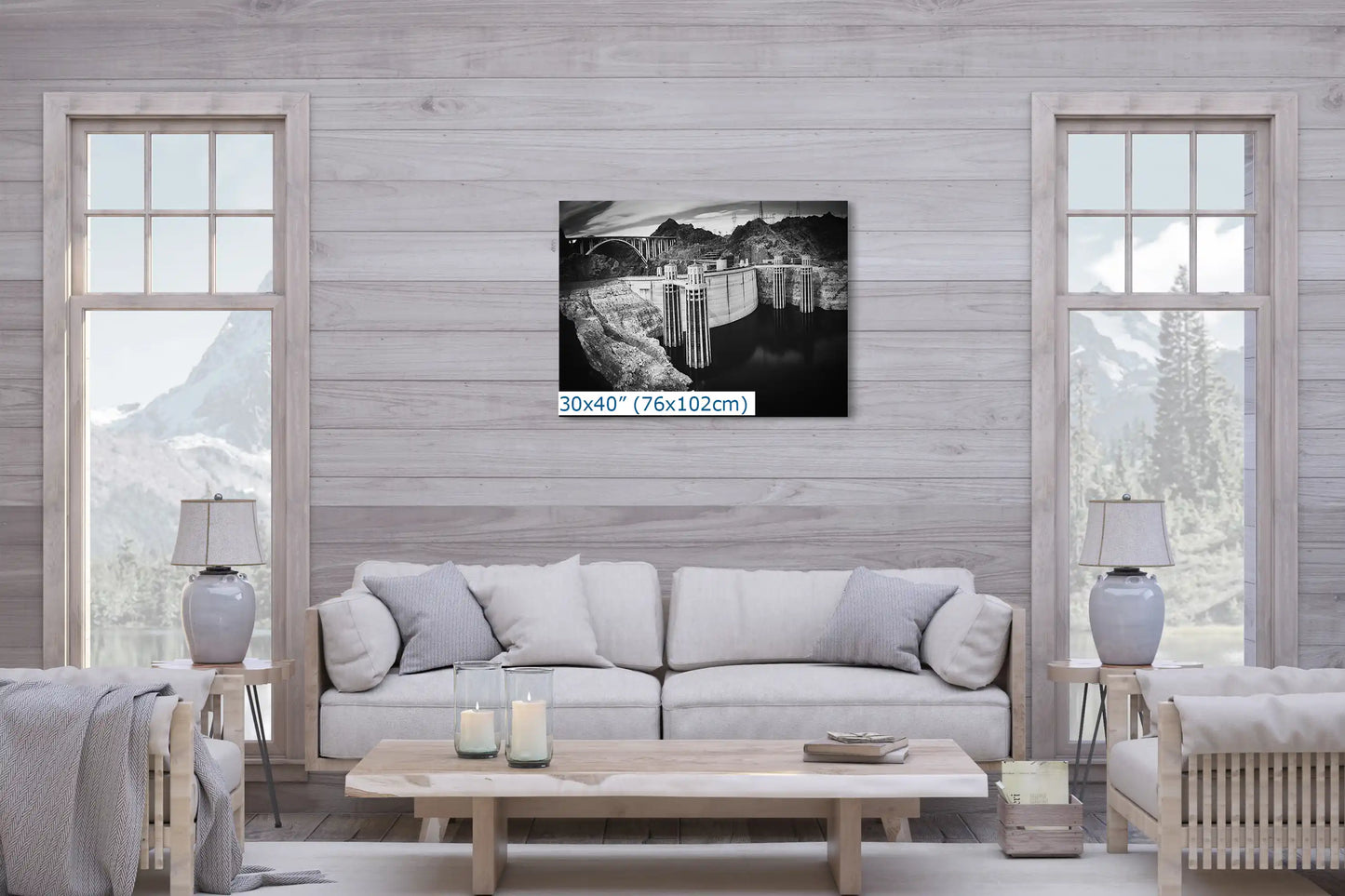 A large 30x40 canvas print of Hoover Dam in black and white, creating an impactful visual statement in a contemporary living room.