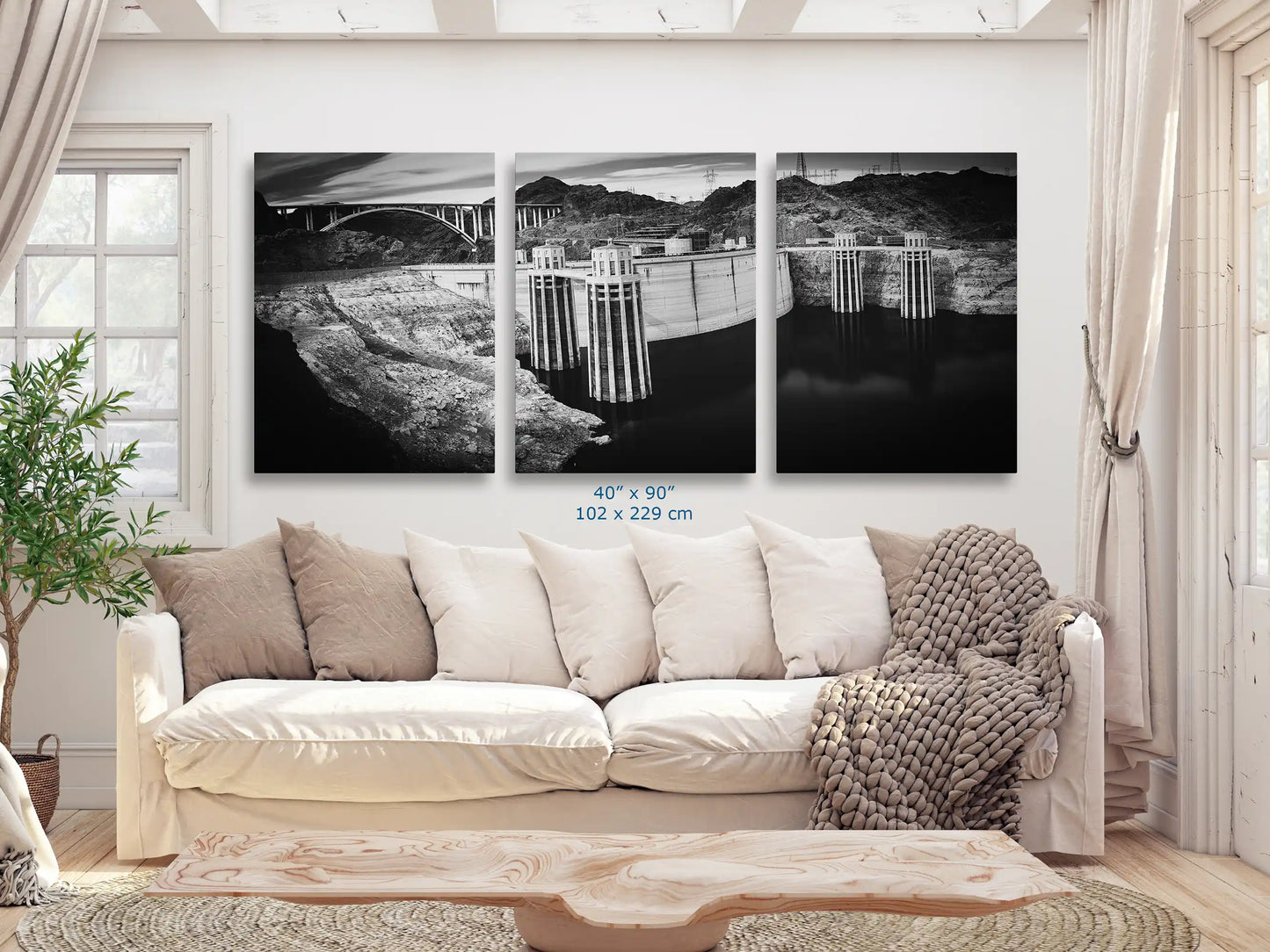 An expansive 40x90 black and white canvas print of Hoover Dam, offering a panoramic view that enhances the living room ambiance.