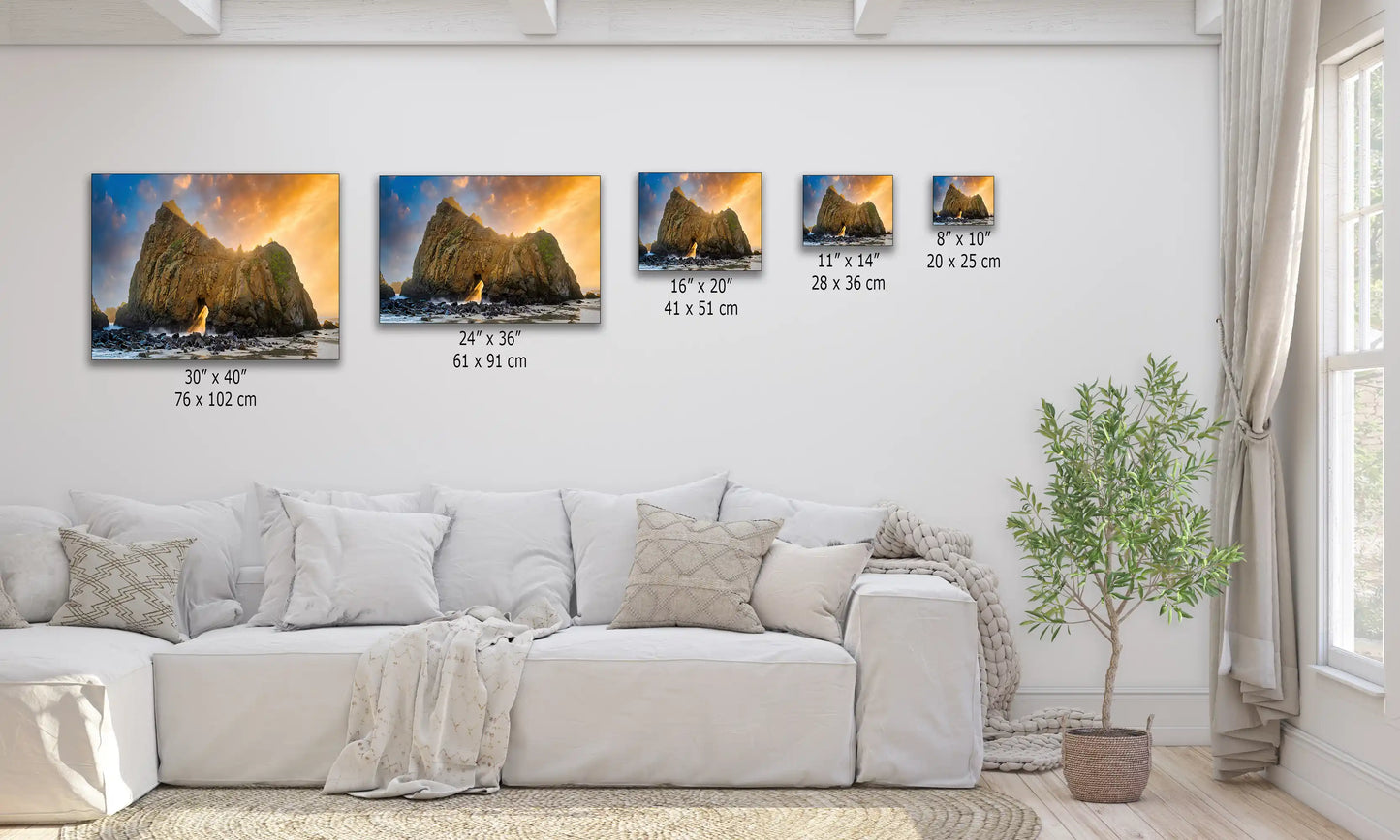 Various sizes of the Keyhole Arch canvas prints above a couch, illustrating the scale from 8"x10" to 30"x40", with a breathtaking sunset view.