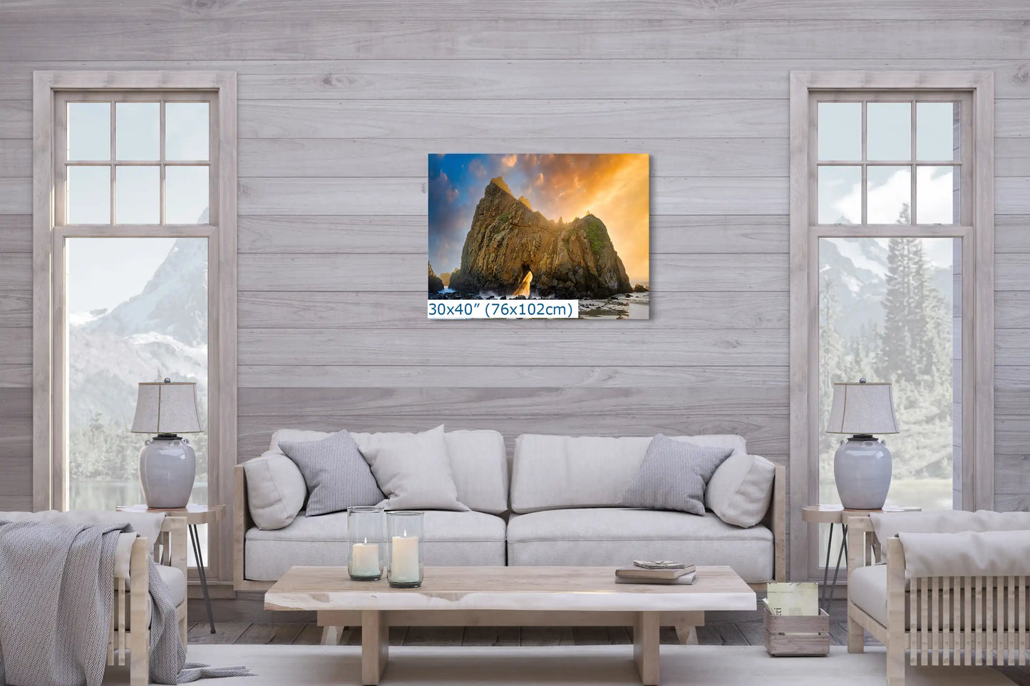 A large 30"x40" canvas print in a living room, featuring the Keyhole Arch with a golden sunset, acting as a bold natural centerpiece.