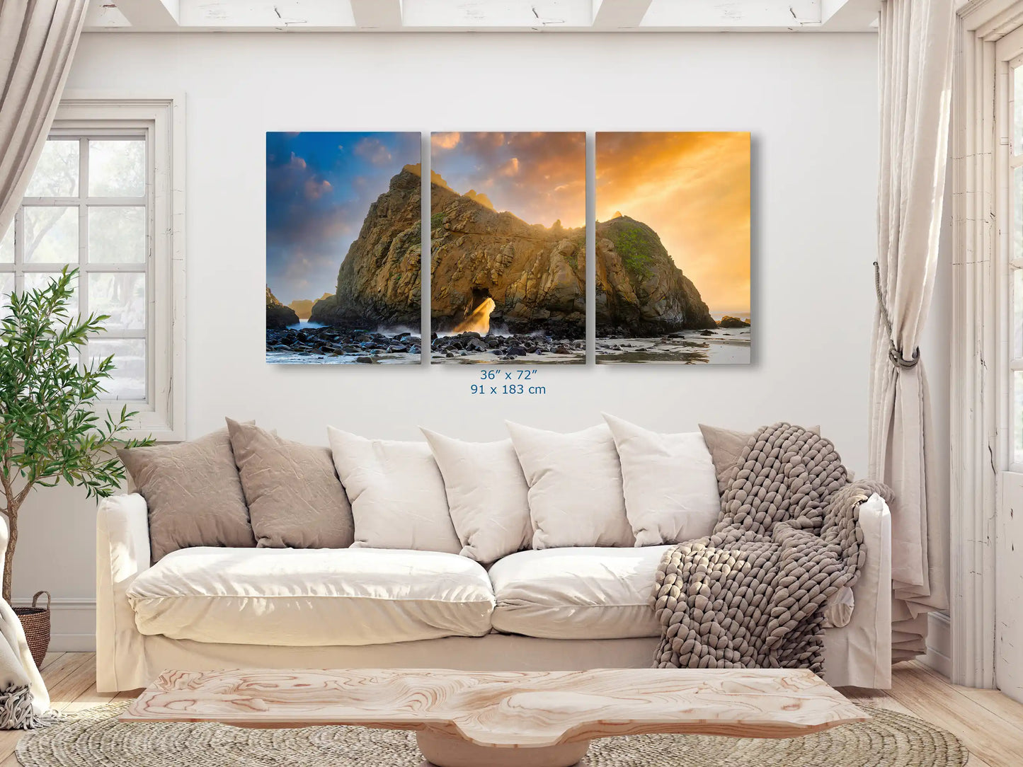 A panoramic 36"x72" canvas in a living room, presenting Keyhole Arch with a sunset, offering a stunning view that stretches across the space.