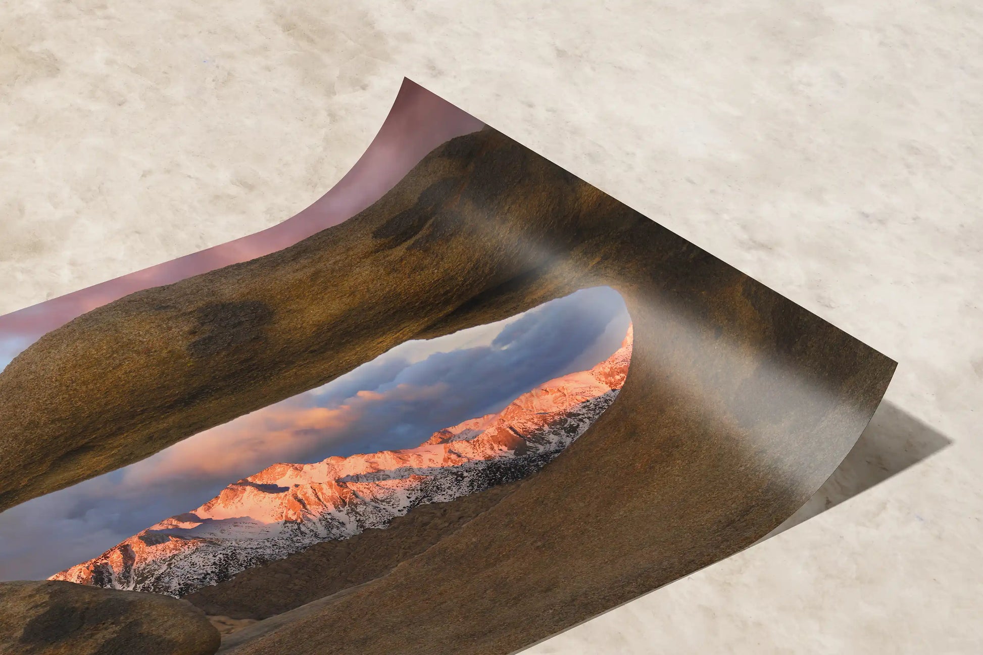 Close-up of a paper print texture, showcasing the fine details of Lone Pine Peak through Mobius Arch photograph.