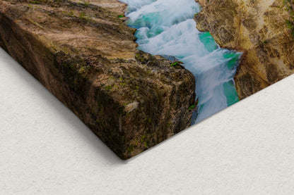 Close-up of canvas corner showing detailed texture of Lower Yellowstone Falls and Canyon with vibrant blue river waters.