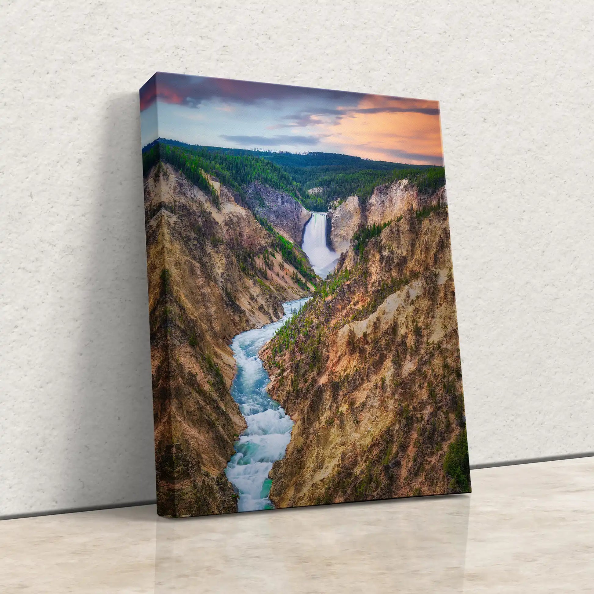 A side view of a wrapped canvas print, with the sunset-lit sky of Lower Yellowstone Falls and the canyon extending over the edges for a 3D effect