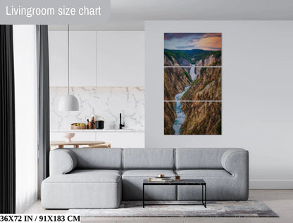 A 36x72 inch wall art piece of Lower Yellowstone Falls at sunset in a spacious living room, adding a natural element to the decor.