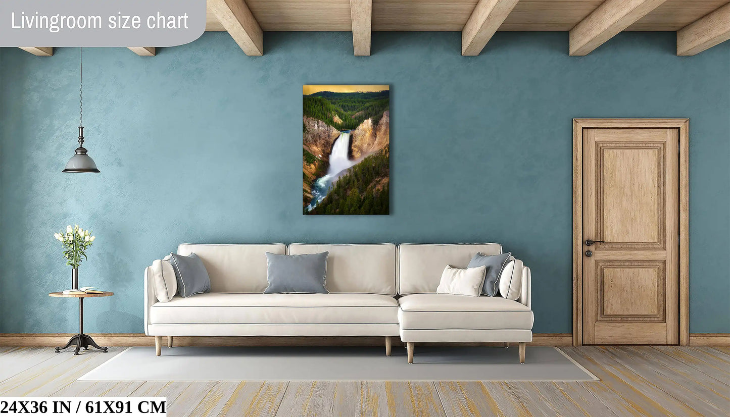 A 24x36 inch canvas print of Lower Yellowstone Falls at sunset in a living room, offering a natural focal point above a couch.