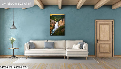 A 24x36 inch canvas print of Lower Yellowstone Falls at sunset in a living room, offering a natural focal point above a couch.