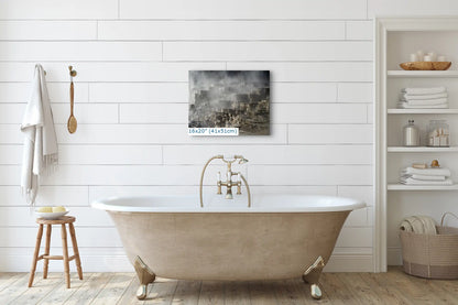 A 16x20 inch canvas print of Mammoth Hot Springs Terraces, hung above a bathtub in a white-tiled bathroom.