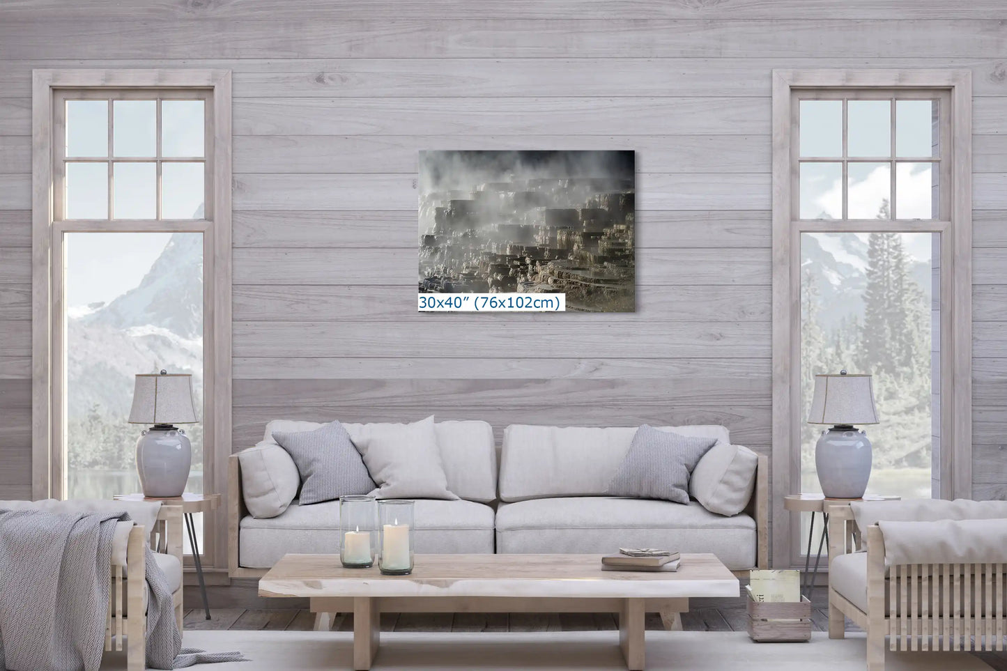 Large 30x40 inch wall art of Mammoth Hot Springs Terraces in a living room above a gray couch, adding a focal point.
