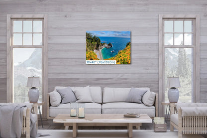 A 30x40 canvas wall art of McWay Falls at Big Sur in a living room, offering a stunning view of the coastal landscape.