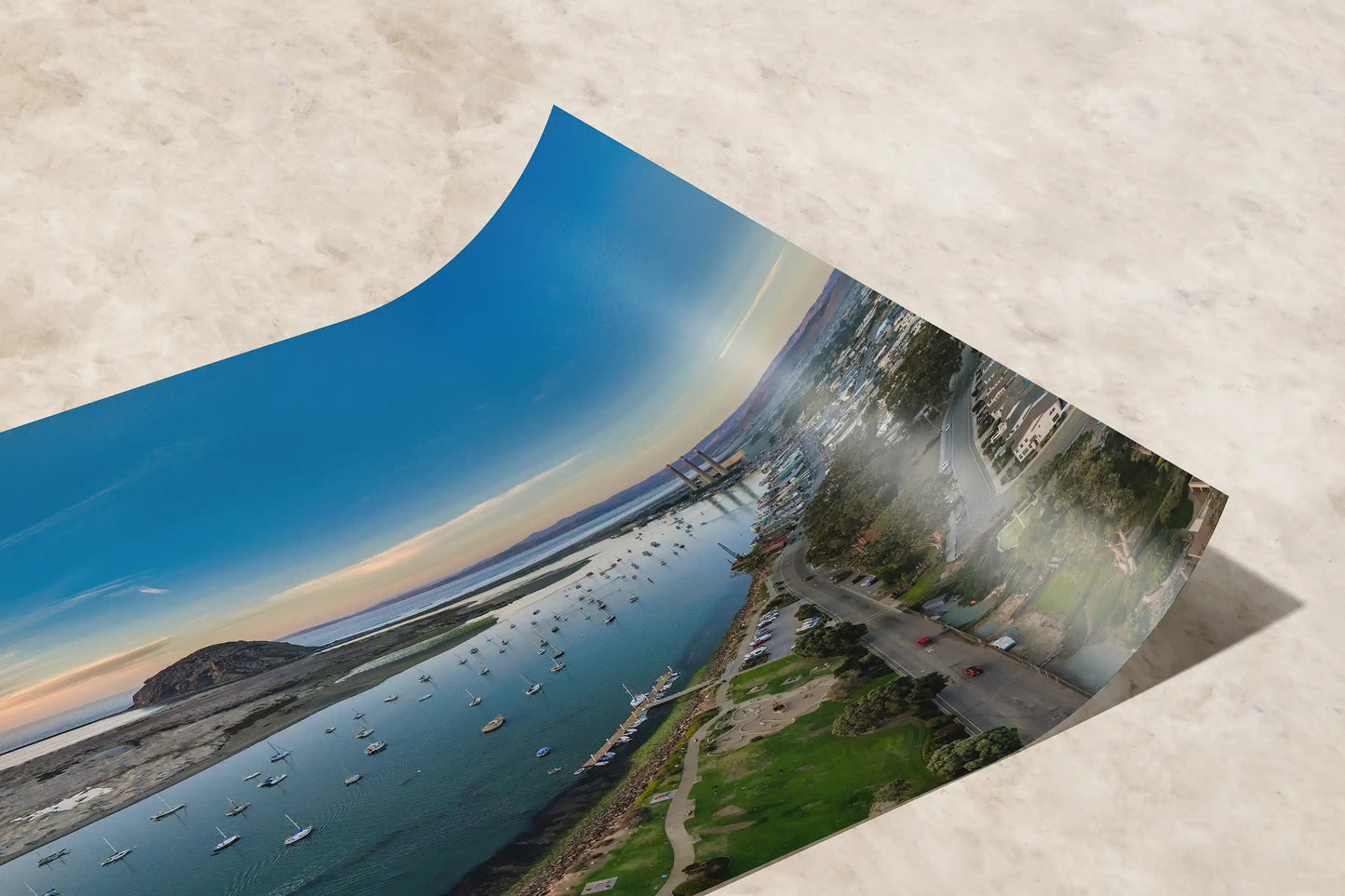 Close-up of a premium paper print showing the detailed textures of Morro Bay aerial, awaiting a custom frame to enhance any room.