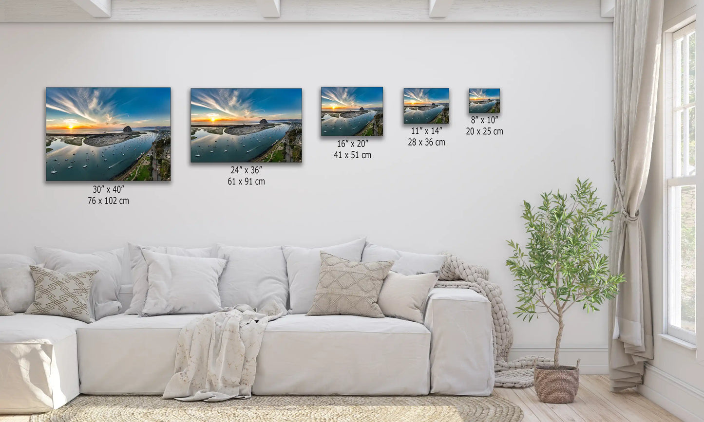 A display of various-sized canvas prints depicting an aerial view of Morro Bay, capturing the essence of the tranquil Pacific coast.