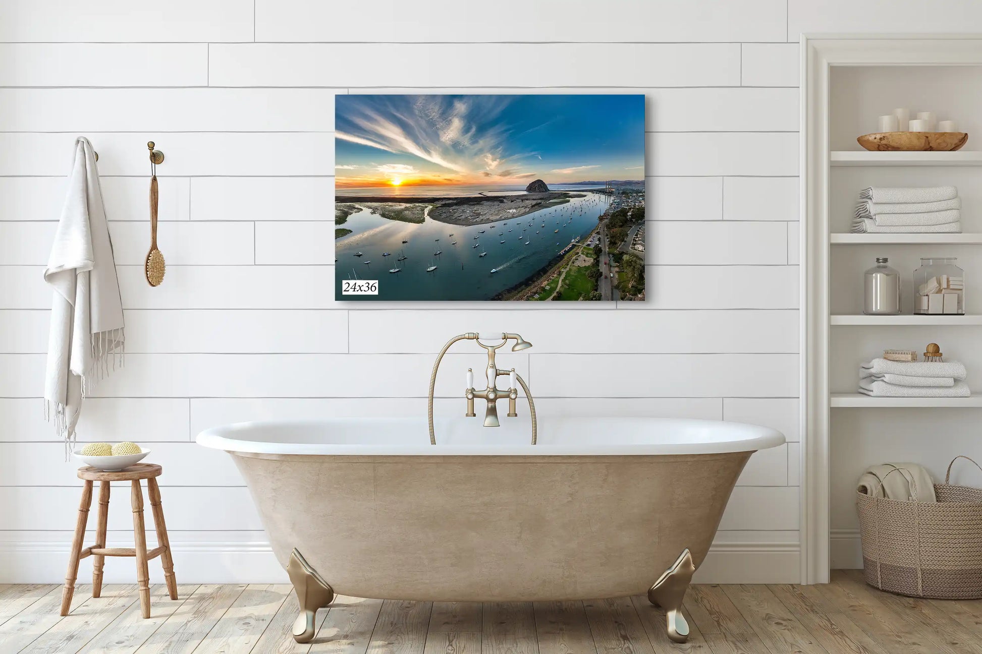 A 24x36 canvas print over a bed, displaying Morro Bay's sunset splendor, perfect for central coast aficionados seeking serene home decor.