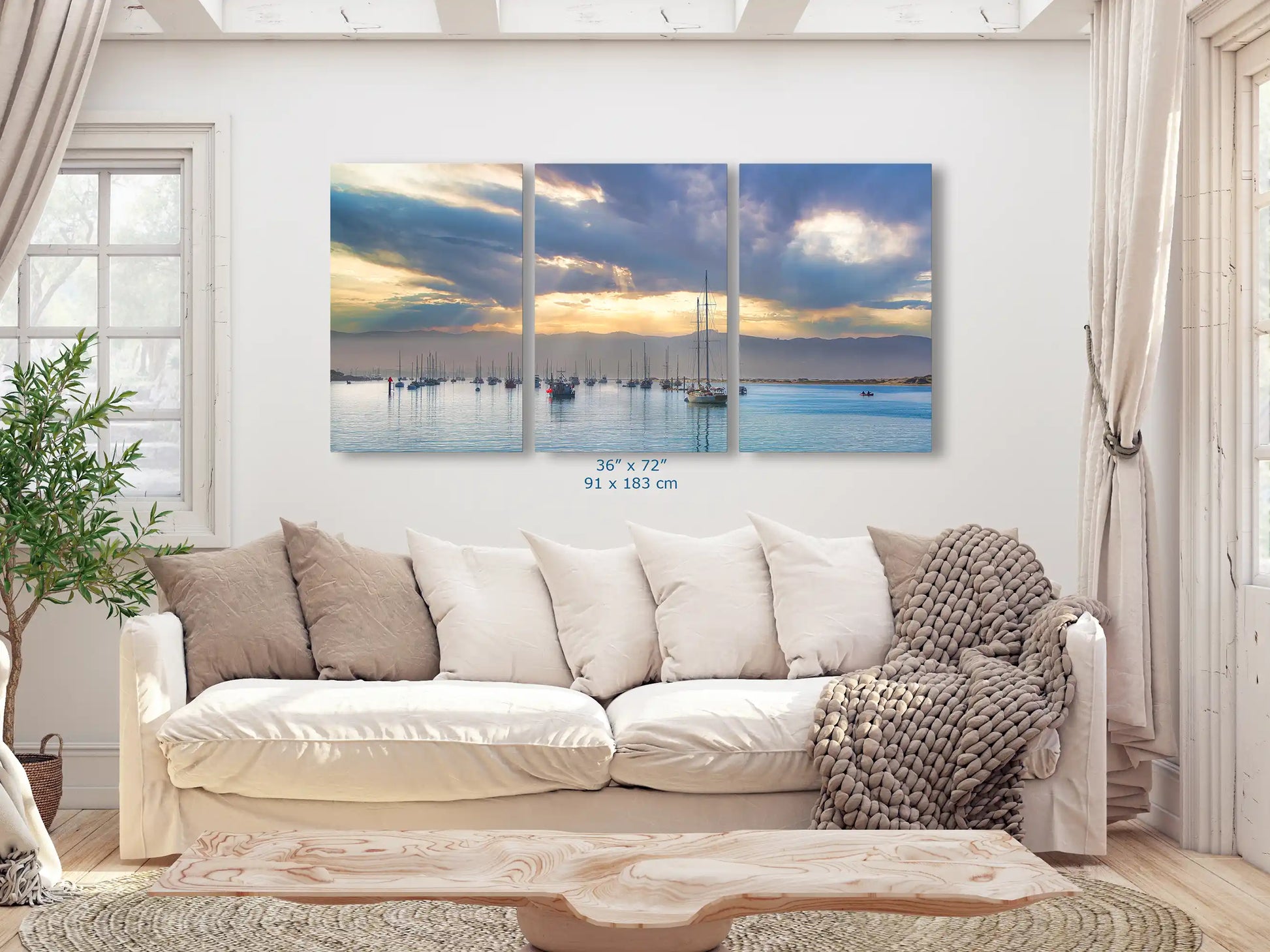 An immersive three-panel canvas print, sized 36x72 inches, in a living room, presenting a wide-angle sunrise harbor scene.