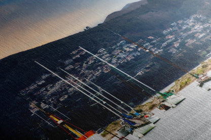 Close-up of a canvas print highlighting the textured details of Morro Bay at sunrise, with sailboats and sealions adding life to the tranquil scene.