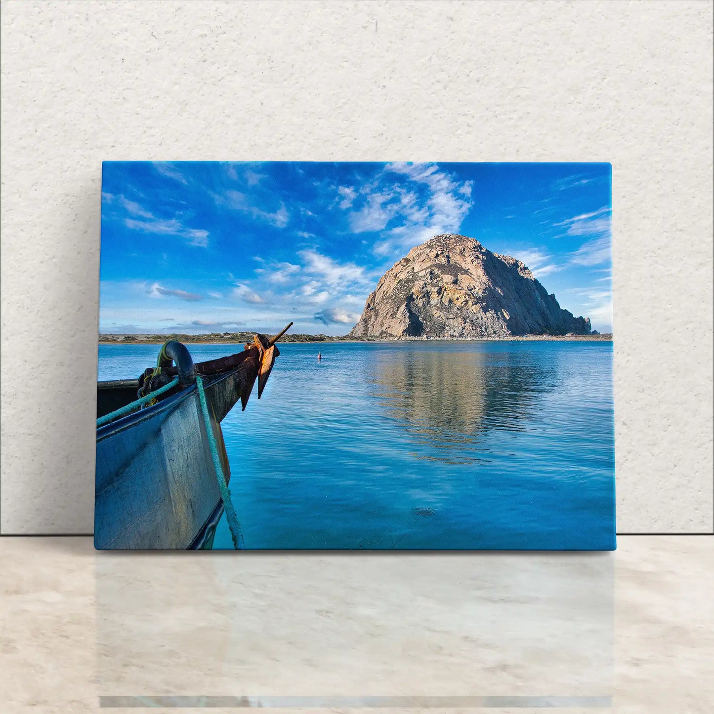 Canvas print of a boat bow aiming at Morro Rock under clear skies, encapsulating the serene essence of Morro Bay, California.
