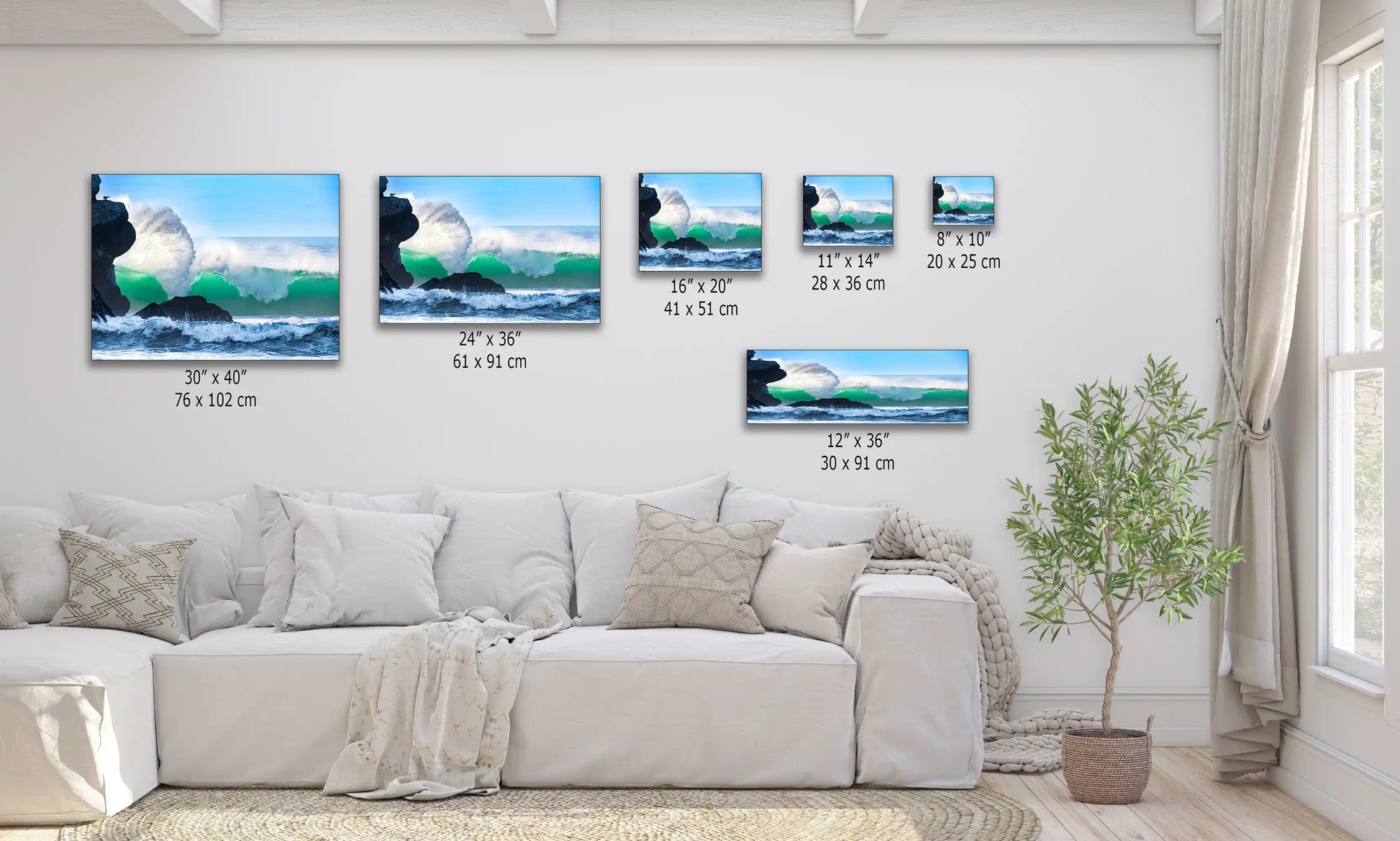 Multiple canvas prints of various sizes depicting a dynamic ocean wave by Morro Rock, displayed above a sofa for scale.