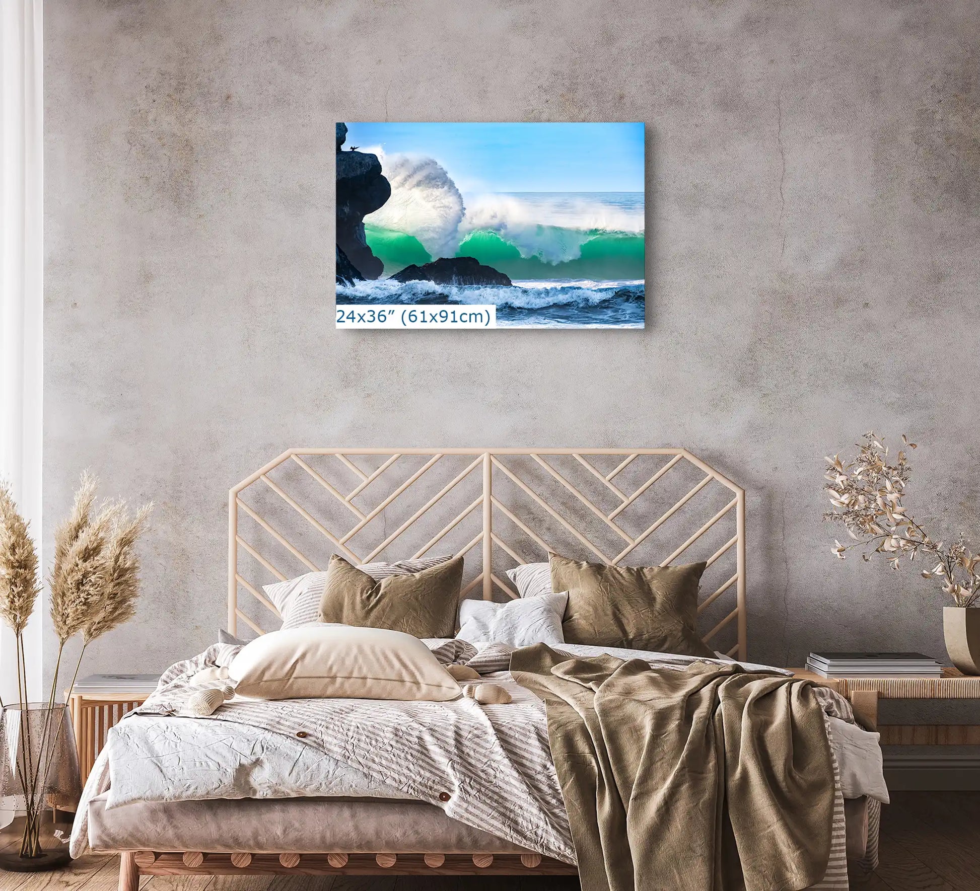A 24"x36" canvas print of a majestic ocean wave near Morro Rock, positioned above the bed as a striking bedroom focal point.