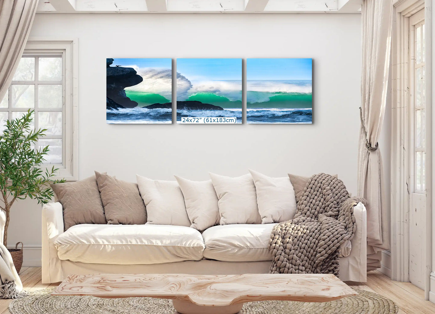 A 24"x72" triptych canvas set of an ocean wave by Morro Rock, spans across the living room wall, offering a panoramic view.