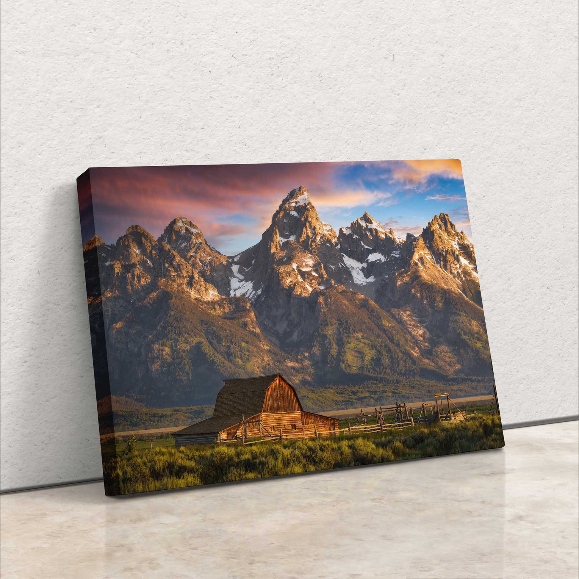 Side view of a canvas wall art depicting the John Moulton Homestead against the Teton Mountains, highlighting the rich colors of sunrise at Grand Teton National Park.