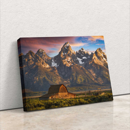 Side view of a canvas wall art depicting the John Moulton Homestead against the Teton Mountains, highlighting the rich colors of sunrise at Grand Teton National Park.