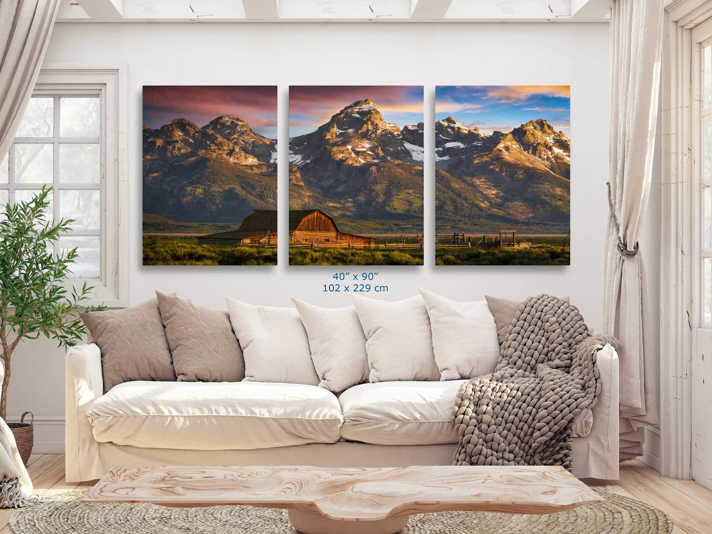 A wide 40x90 canvas print of the John Moulton Homestead in front of the Teton Mountains at sunrise, spanning the length of the couch for a dramatic effect in the living space.